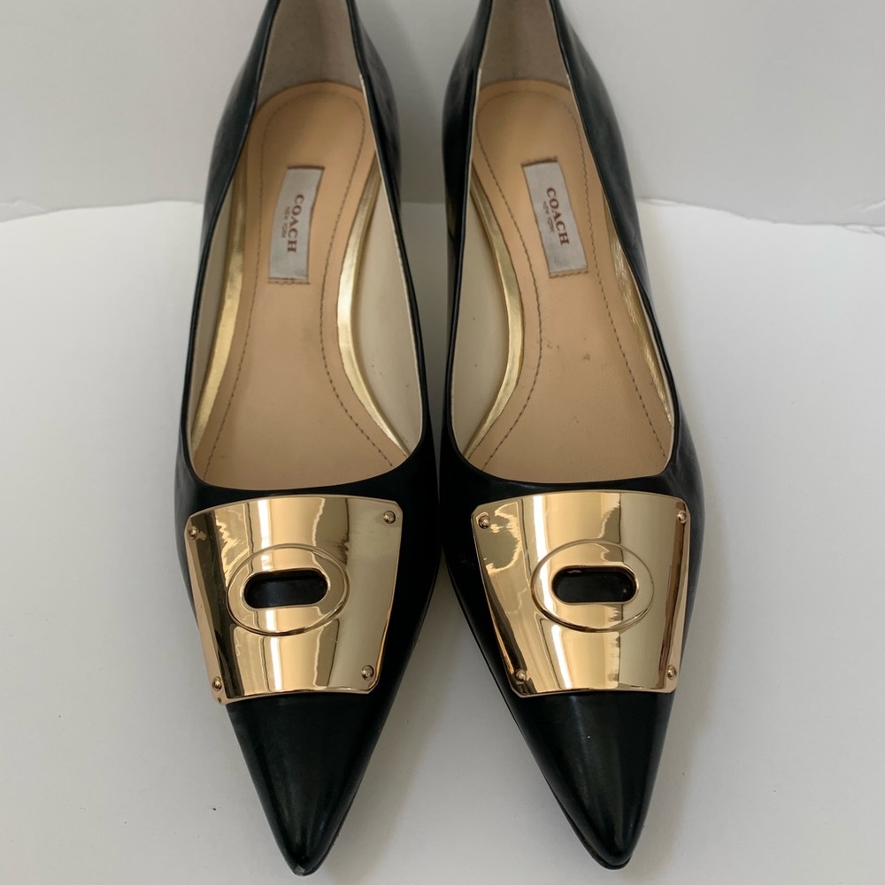 Coach Size 7 pointy toed black low heeled pumps.